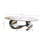 Table basse ovale de 124 cm avec plateau en pierre frittée imitation marbre et piètement sculptural en acier inoxydable